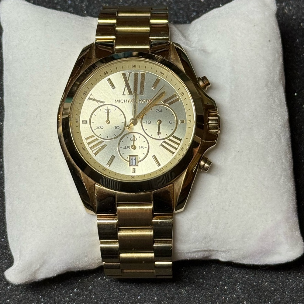 Michael Kors gold oversized watch.